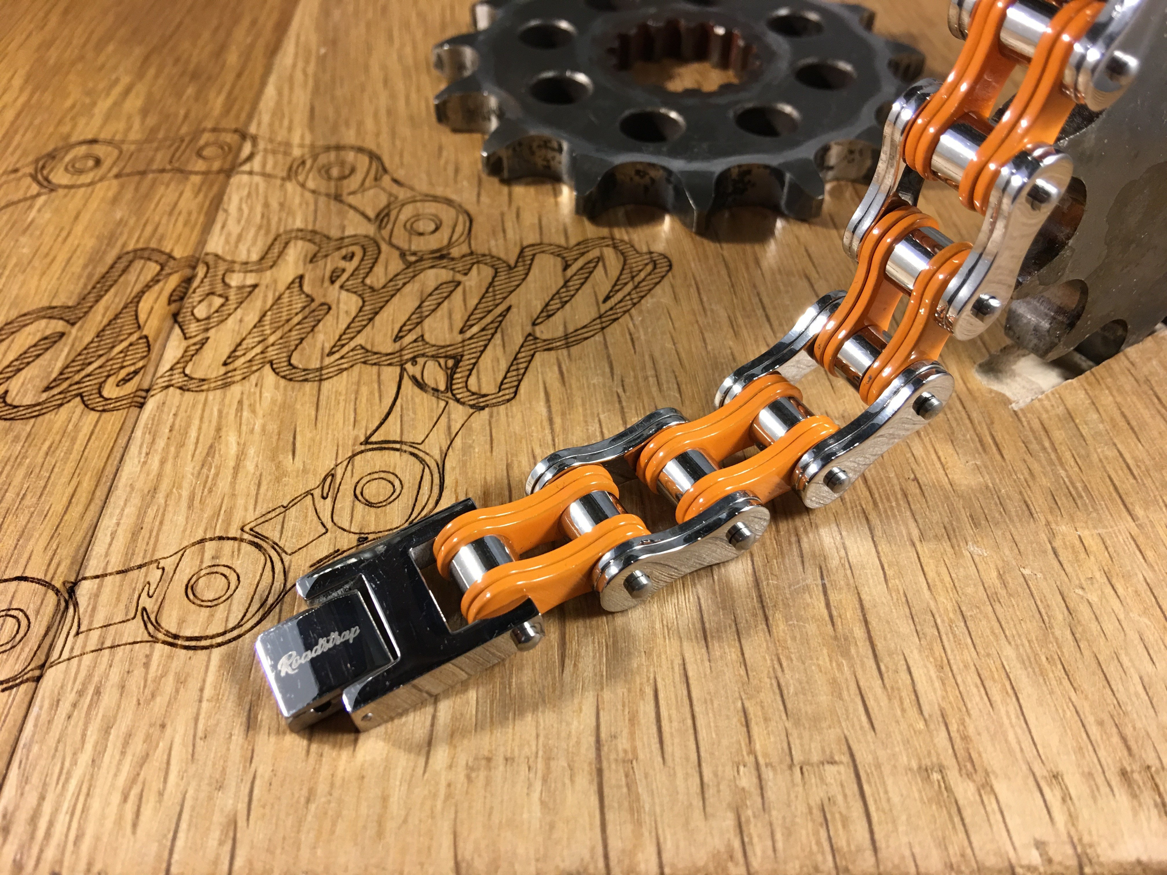 Bracelet chaîne homme orange/acier